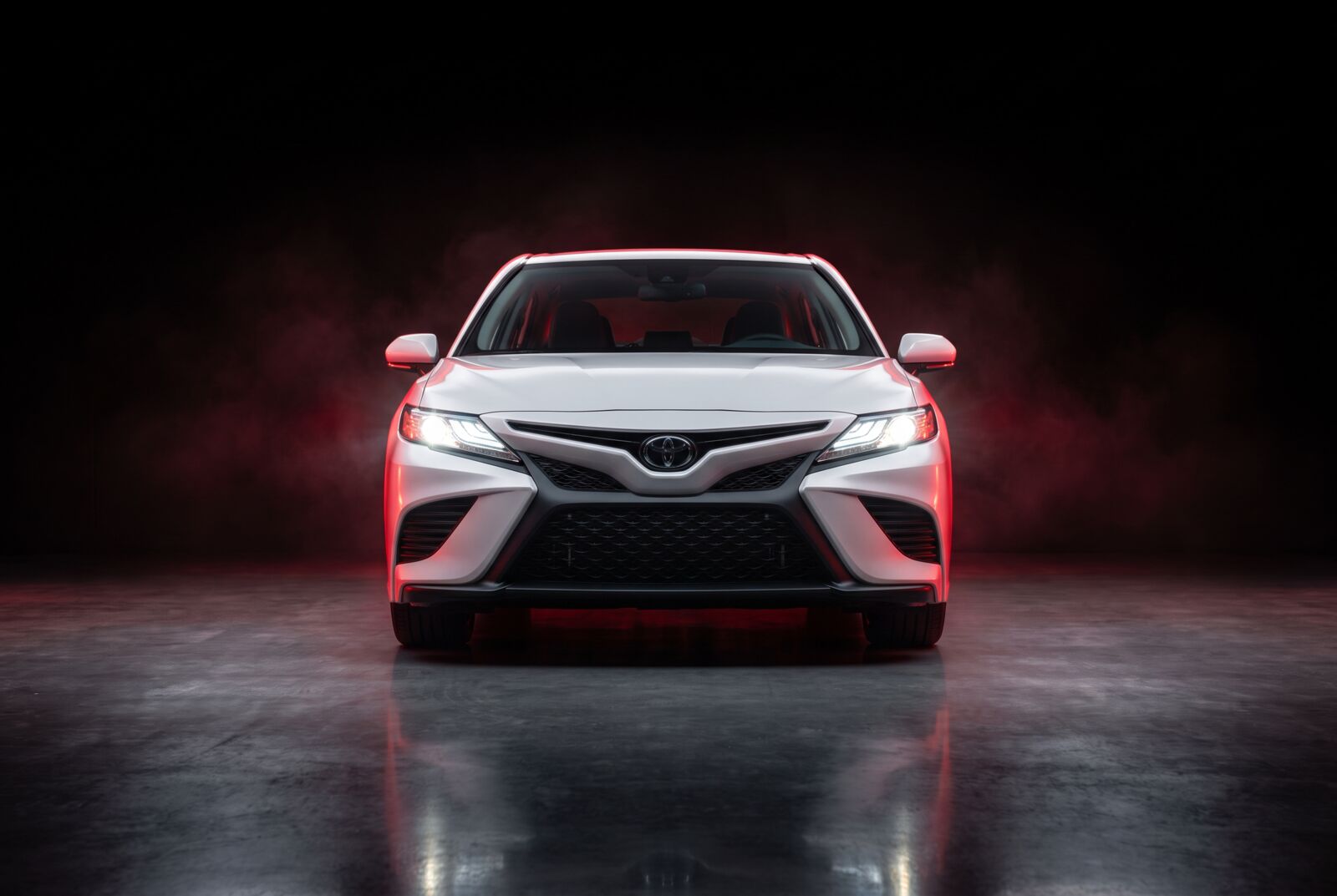 White Toyota Camry head-on front view — Fly Wheels car lift fleet, Dubai