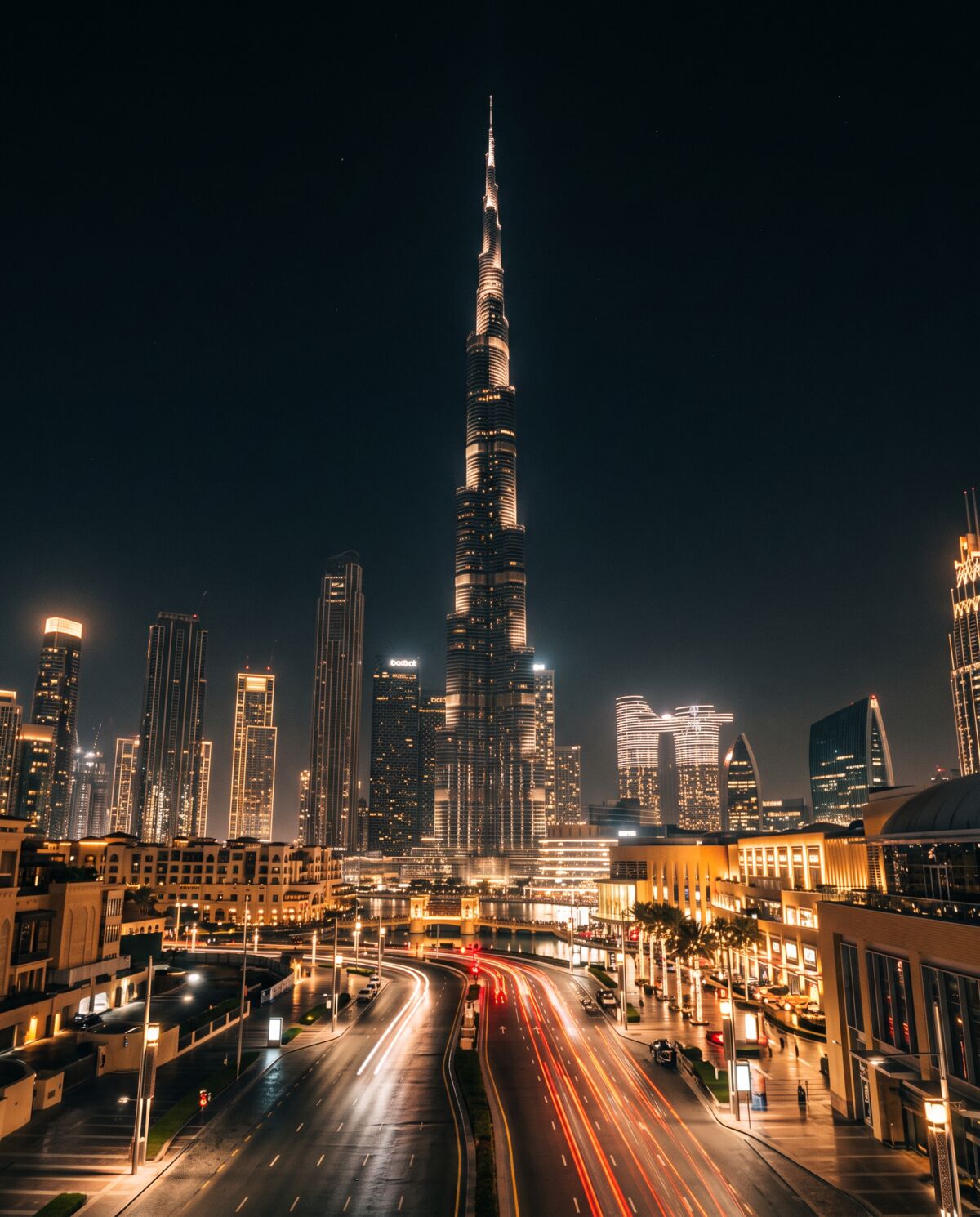 Burj Khalifa glowing over downtown Dubai at night
