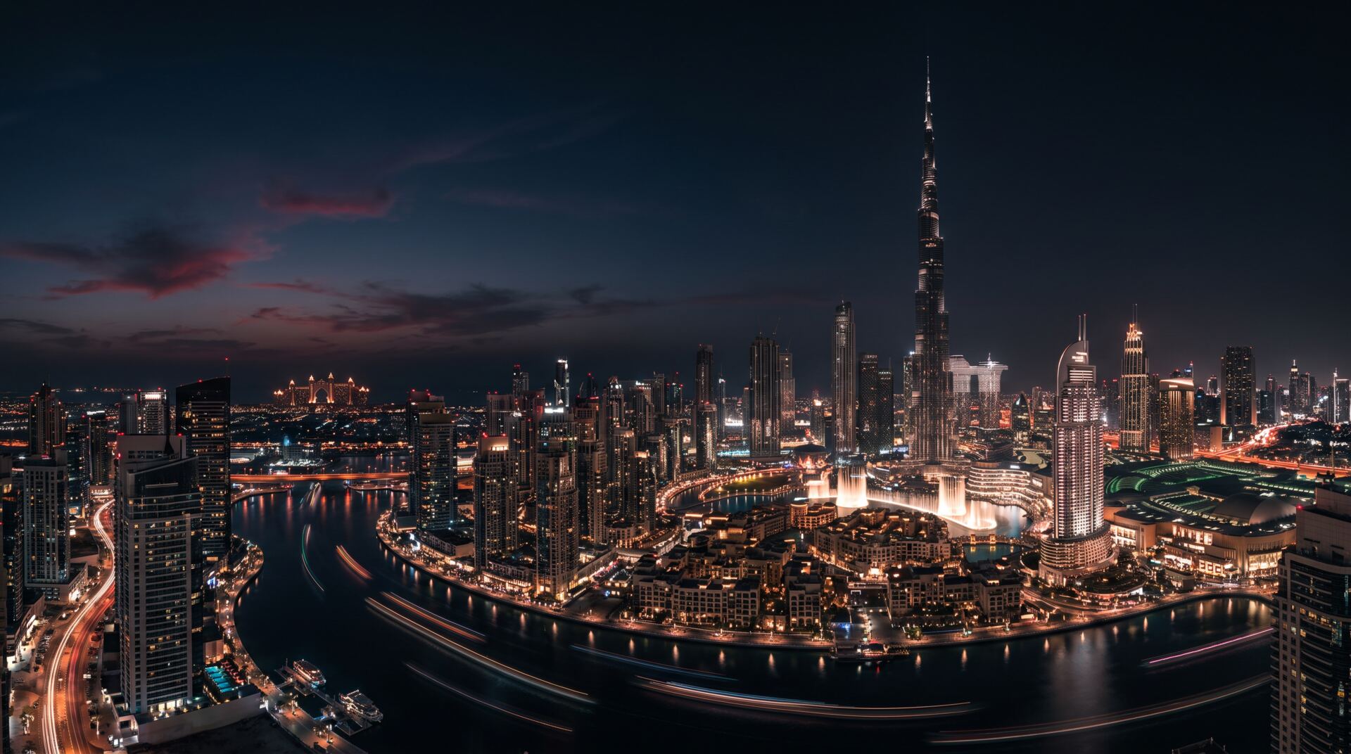 Dubai skyline at blue hour with Burj Khalifa glowing